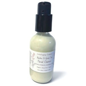 May include: A clear glass bottle containing a pale green facial cleanser with a black pump dispenser. The white label reads LittleStuff4u Cosmetics Rooibos & Green Tea Facial Cleanser, Soothe | Hydrate | Nourish | Tone, Organic + Gluten Free + Vegan, 2 oz | 60ml Made in USA.