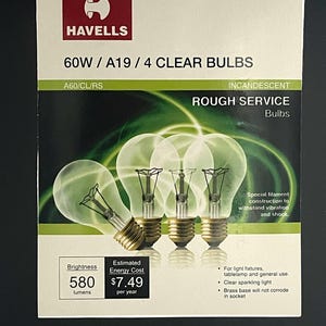 May include: A box of four clear incandescent light bulbs, branded "HAVELLES", with a brightness of 580 lumens. The package states the bulbs are 60W/A19 and suitable for rough service. Features include a brass base and special filament construction.