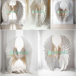 May include: A white backdrop with two large white angel wings with gold tips. The wings are positioned to look like they are framing a space. The backdrop is perfect for photography.