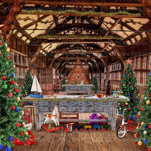 May include: A Christmas-themed backdrop featuring decorated trees, ornaments, and a gingerbread house. A wooden workbench displays toys, including a rocking horse, train set, and tricycle. The backdrop has a rustic interior with a wooden ceiling and walls.