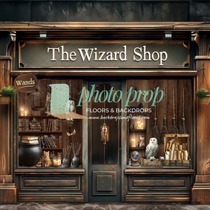 May include: A detailed photo prop backdrop depicting a wizard shop exterior. The shop front features the text "The Wizard Shop" above the entrance. The scene includes wands, books, candles, a cauldron, and an owl, creating a magical atmosphere.