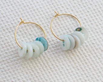 Earrings with mother-of-pearl buttons