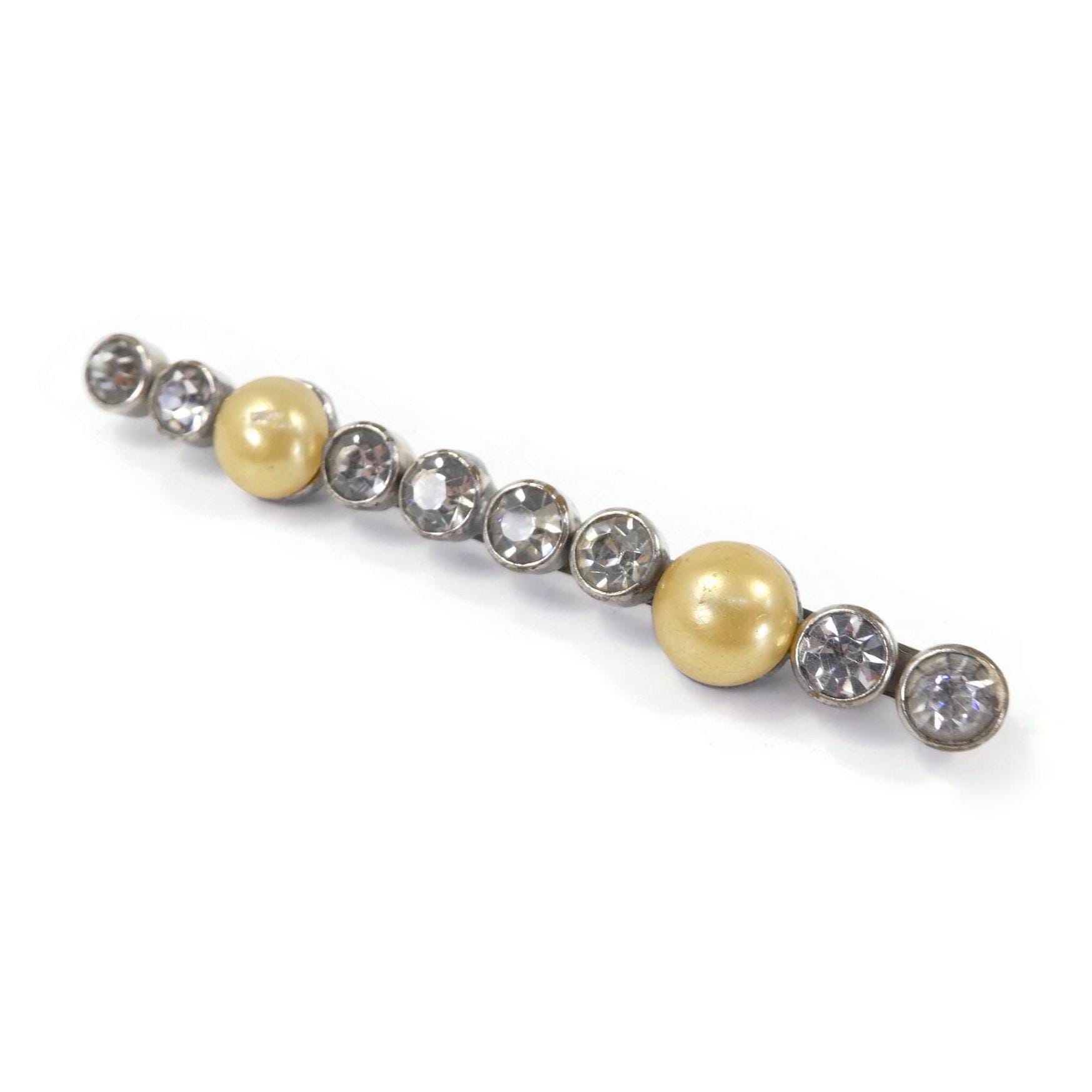 Broche bar vintage en fausses perles strass ton or signée Monet