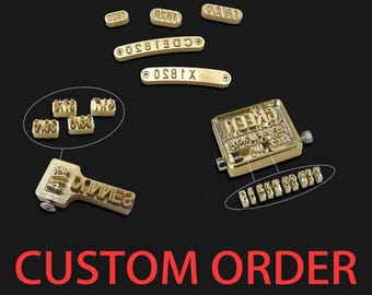 May include: A collection of brass stamps and a stamp handle are displayed against a black background. The stamps include individual letters, numbers, and phrases. The text "CUSTOM ORDER" is written in red at the bottom of the image.