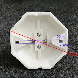 May include: White octagonal electrical box with four screw terminals and the text "6A 250V". The box measures 7.5 inches by 6.3 inches and 9.5 inches diagonally.