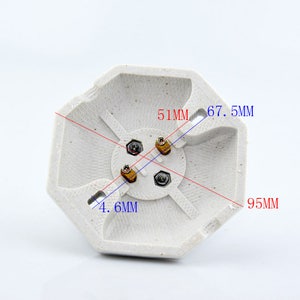 May include: White ceramic light bulb socket with three gold-colored terminals. The socket is octagonal and measures 4.6 inches in diameter, 5.1 inches across, and 6.7 inches from corner to corner.