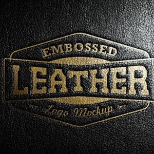 May include: Embossed gold "Leather Logo Mockup" text on a black leather background.