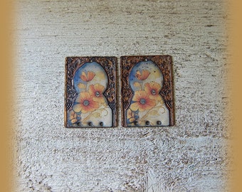 2 enameled copper charms