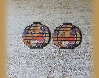 2 enameled copper charms