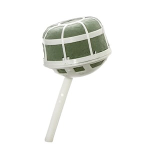 May include: A green and white floral foam ball with a white plastic stem. The ball is designed for holding flowers and is used in floral arrangements.