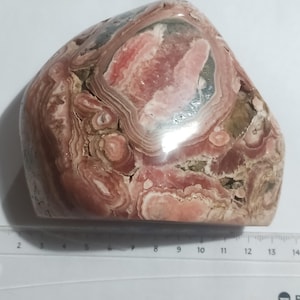 Beauty Rhodochrosite polished freeform.