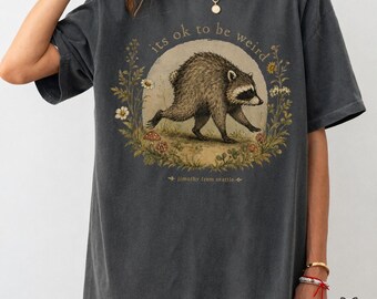 It’s OK to Be Weird Raccoon Shirt, Funny Raccoon Graphic Tee, Jimothy Seattle Shirt, Cottagecore Wildlife T Shirt, Quirky Animal Gift