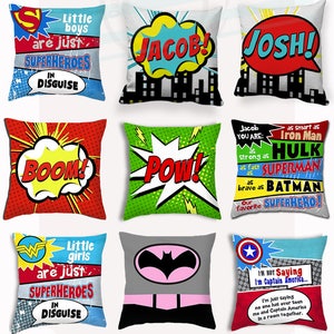 May include: A set of 10 colorful pillow covers featuring comic book superhero themes. The covers feature various superhero logos, characters, and phrases like "BAM!" and "POW!"  The covers are designed for children and feature names like "Jacob" and "Josh".