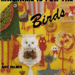 May include: A book cover with the title "Macrame is for the Birds" by Judy Palmer. The cover features a yellow background with colorful macrame bird decorations.