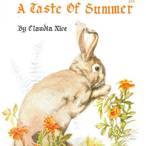 May include: A watercolour illustration featuring a rabbit with tan fur, set amongst orange and yellow flowers. The text reads "A Taste Of Summer" at the top, with "By Claudia Nice" and "Presented by Sue Scheewe" below.