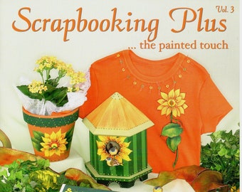 May include: A scrapbook page with a green background and a yellow border. The page features a photo of children on a playground, a sunflower, and the text "Sunshine & Smiles" and "Camp Opa & Oma 2002".