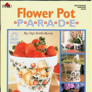 May include: A book titled "Flower Pot Parade" with 15 flower pot painting projects. The cover features a painted flower pot with strawberries and a yellow bow, and three other painted flower pots.