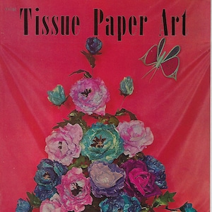 May include: A vintage book cover featuring the title "Tissue Paper Art" in bold black letters. The cover features a colorful bouquet of tissue paper flowers in a dark brown vase, with a pink butterfly flying above the flowers. The background is a vibrant pink.
