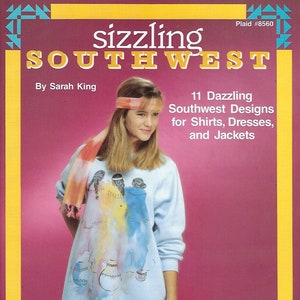 May include: A book cover with a yellow background and a turquoise and blue border. The title is "sizzling SOUTHWEST" with the word "sizzling" in a larger font. The subtitle is "11 Dazzling Southwest Designs for Shirts, Dresses, and Jackets". The author is listed as "By Sarah King". A young woman with long blonde hair is wearing a light blue sweatshirt with a colorful Southwest design. She is wearing a headband and a scarf with a similar design.
