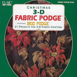 May include: A book cover with a green background and a red poinsettia flower. The title is "Christmas 3-D Fabric Podge" featuring "Mod Podge". The book features 21 projects for 3-D fabric crafting.