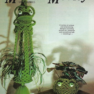 May include: A green macrame frog plant hanger with a plant inside, and a smaller green yarn ball with a face and a plant. The image has the text "Macra - Medley".
