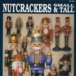 May include: A collection of small and tall nutcrackers in various designs. The nutcrackers are painted in a variety of colors, including red, blue, and gold. The image has the text "NUTCRACKERS & TALL" at the top.