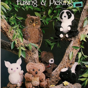 May include: A selection of plush animal toys, including an owl, panda, rabbit, koala, bear, and skunk, are arranged on tree branches. The image has the text "Everything You Need To Know About Fusing & Picking" at the top.