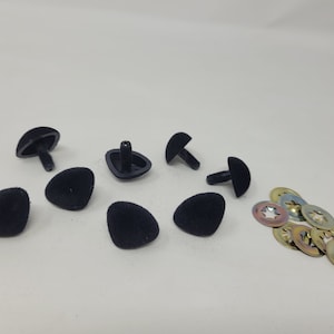May include: A set of black plastic safety eyes with a star-shaped washer for sewing or crafting projects. The eyes come in different sizes and are ideal for plush toys, stuffed animals, and other crafts.