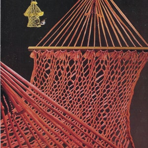 May include: A red hammock with a wooden frame and a woven net. The hammock is hanging from the ceiling.