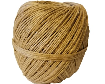 May include: A tightly wound ball of natural-colored twine. The twine is wrapped around itself in a spiral pattern, with a band of twine encircling the middle. The twine appears to be made of a natural fiber.