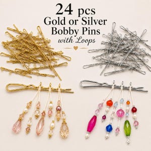 May include: A set of 24 gold or silver bobby pins with loops. The image displays loose gold and silver pins alongside two examples decorated with dangling multi-colored crystal and pearl beads attached to the loops with white string.