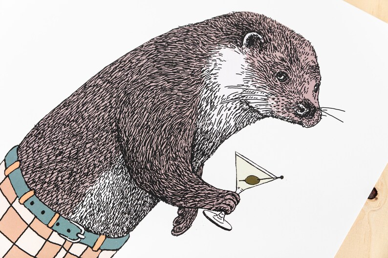 May include: A brown and black otter wearing a plaid shirt and holding a martini glass with an olive.