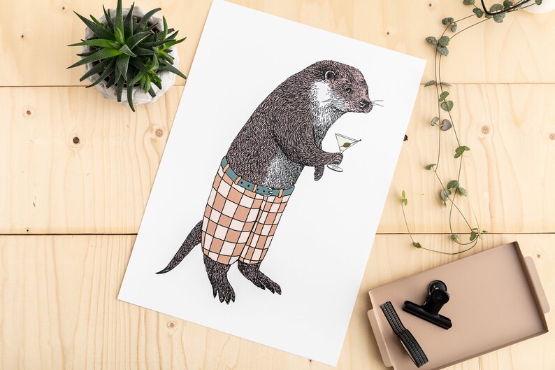 May include: A black and white illustration of an otter wearing plaid pants and holding a martini glass. The otter is standing on a white background.