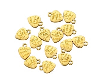 May include: Gold heart-shaped charms with the text "Made with Love" on each charm. The charms have a loop at the top for attaching to jewelry or other crafts.