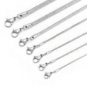 May include: A set of six silver snake chain necklaces of varying lengths. The chains are made of stainless steel and have a polished finish.