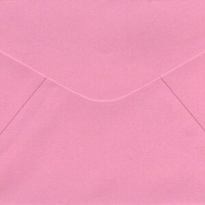 May include: A plain pink envelope with a white flap.