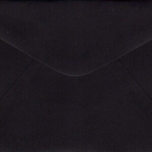 May include: A black envelope with a standard flap.