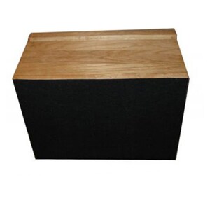 May include: A rectangular wooden box with a natural light brown wood grain top surface and a solid black front panel. The top piece features a slightly raised edge along the back, creating a clean, structured design with contrasting colors.
