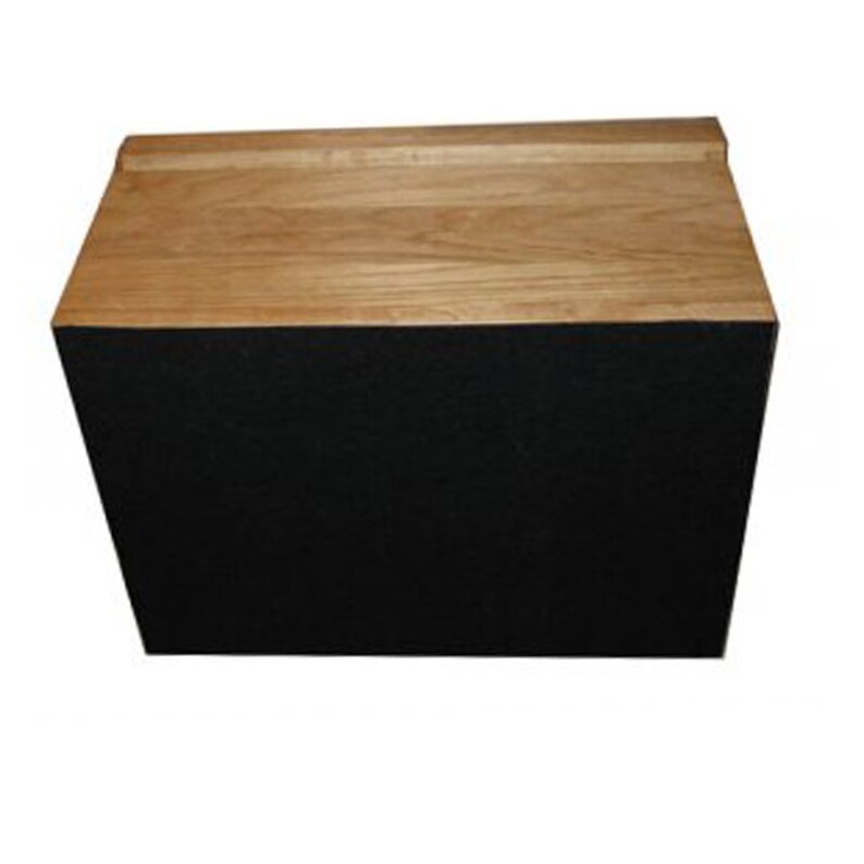 May include: A rectangular wooden box with a natural light brown wood grain top surface and a solid black front panel. The top piece features a slightly raised edge along the back, creating a clean, structured design with contrasting colors.