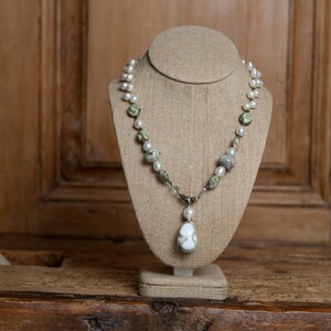 Beautifully hand wrapped ocean jasper set off with additional pieces of ocean jasper, difference types of fresh water pearls sterling silver