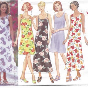 May include: A Butterick sewing pattern featuring illustrations of five different dresses. The dresses have floral and fruit patterns in various colors, including white, yellow, black, and red. The pattern is labeled "Classics & Easy."