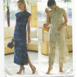 May include: Butterick sewing pattern 6057 by David Warren. The pattern features two women's dresses. One is a dark blue, sleeveless, floor-length dress with a floral pattern. The other is a light-colored, floral-print dress with matching pants.