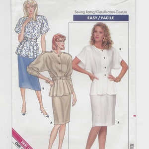 May include: A vintage sewing pattern for a women's skirt suit. The pattern is for sizes 6-8-10 and is rated easy to sew. The pattern features a white skirt suit with a button-up top and a beige skirt suit with a button-up top. The pattern is from Butterick and has the number 5995.