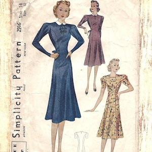 May include: A Simplicity Pattern 2916 sewing envelope featuring illustrations of two dress styles. One is a long-sleeved blue dress with a white collar, and the other is a short-sleeved floral dress. Text includes Size 14, Bust 32, and Price 15c.