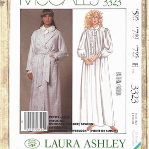May include: A McCall's 3323 sewing pattern envelope for a Laura Ashley robe and nightgown. The cover features a photograph of a person in a patterned robe and an illustration of a person in a long-sleeved nightgown with a ruffled collar.