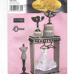 May include: Simplicity pattern number 9593, Series 4, Couturier Doll Clothes. The pattern includes instructions for making a doll-sized dress form, hat stands, and a doll-sized clothing rack.