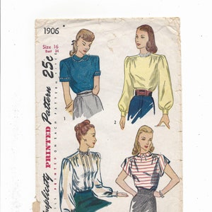 May include: Vintage Simplicity sewing pattern for a blouse, featuring four different styles. The pattern is printed on a white paper with a light blue background. The pattern number is 1906 and the price is 25 cents. The pattern includes instructions for making a blouse with a collar, long sleeves, and a button-up front.