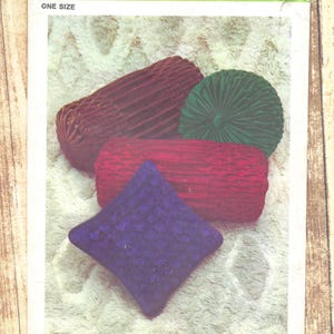 May include: A set of three ceramic vases in varying sizes and shapes. The vases feature a matte white finish and a minimalist design, suitable for displaying flowers or as decorative objects. The tallest vase is approximately 10 inches tall.