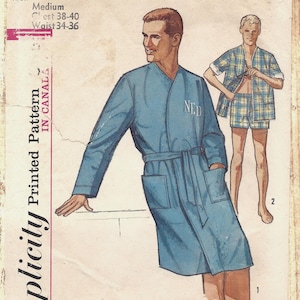 May include: A Simplicity 5387 sewing pattern envelope featuring illustrations of a blue robe with a tie waist and two pockets, and a plaid short-sleeve shirt with matching shorts. The text includes "5387", "Men", "Medium", "Chest 38-40", and "Waist 34-36".