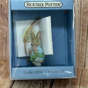 1990 Beatrix Potter Peter Rabbit Eating Carrots with a Book Ornament, from Schmid In Original Box